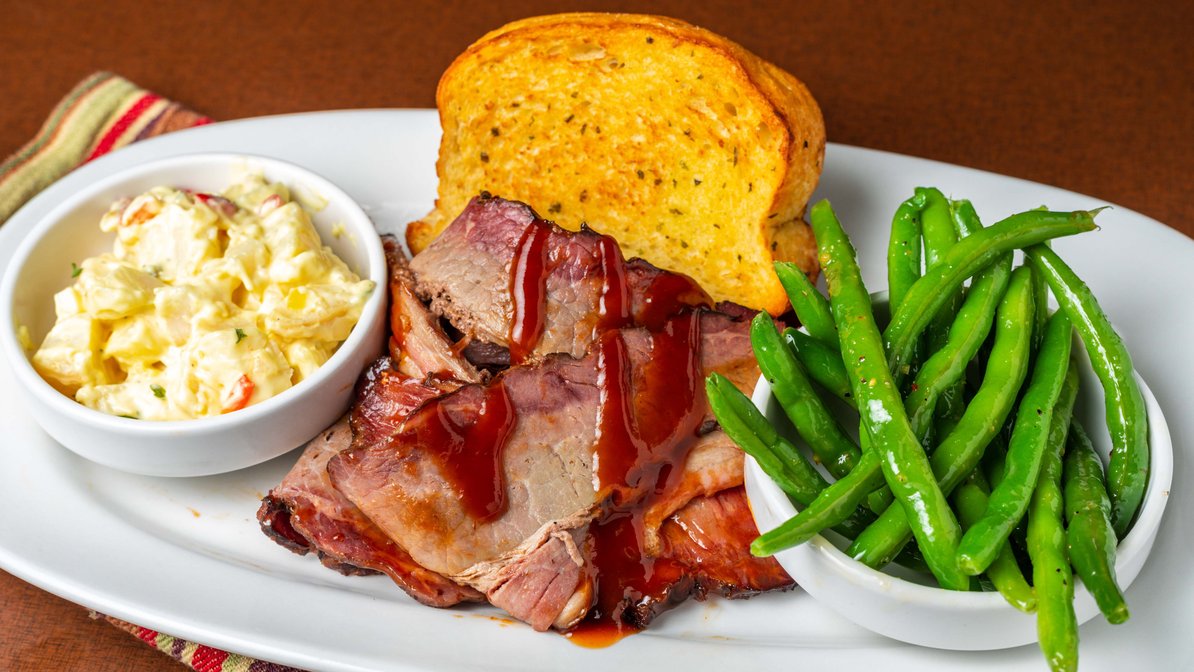 Smoked Beef Brisket with green beans, potato salad and garlic bread