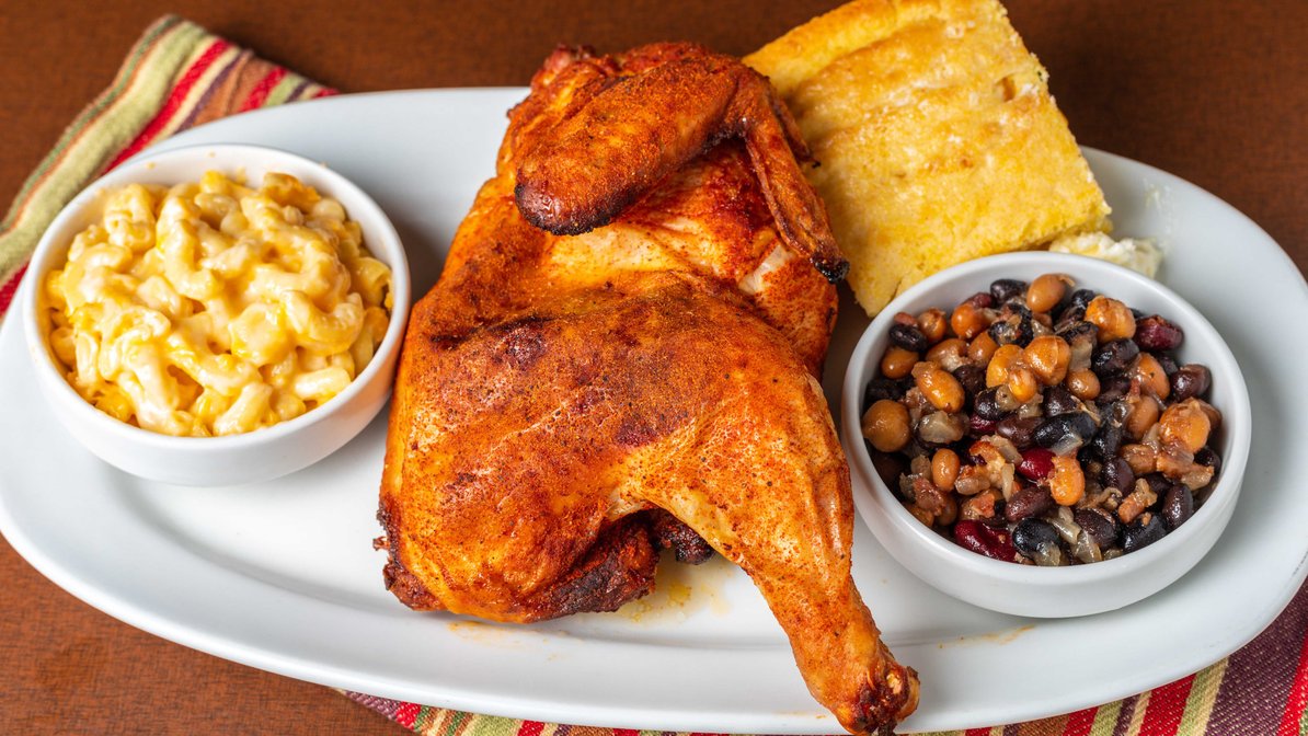 Roasted half yard bird with macaroni and cheese, baked beans and cornbread